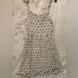 H&M Woman’s Spaghetti Strap White Dress with single black rose print. Sz S
